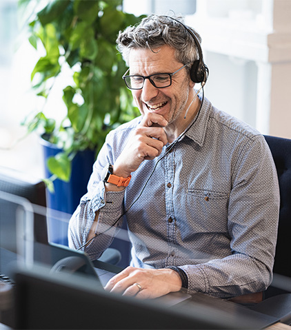 A man attending online meeting